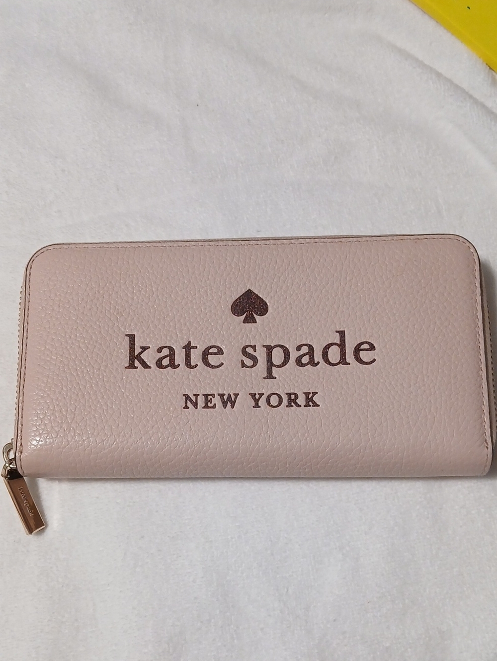 kate spade pale pink logo zip wallet